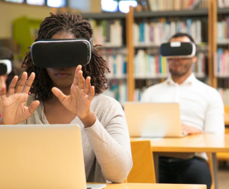 young lady learning with VR goggles 